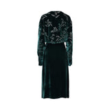 Momonì emerald green velvet midi dress with intricate silver-toned floral embroidery on the chest and sleeves, featuring a round neckline and long sleeves, set against a plain white background.