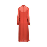 A long-sleeved, floor-length sheer red dress shown from the back, featuring a collar and a semi-transparent overlay, displayed on a clean white background.