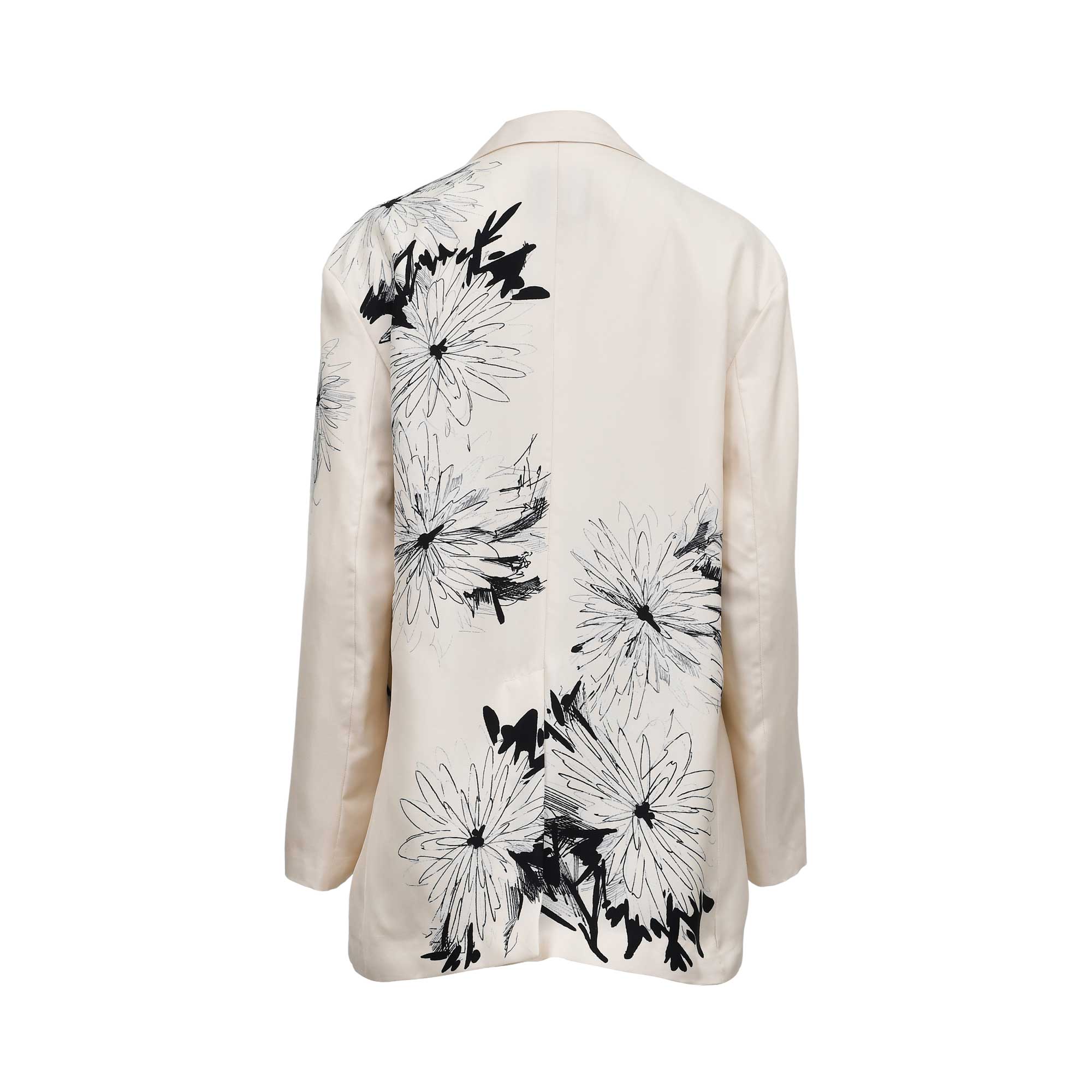 Back view of the Momoni cream blazer, displaying the continuation of the artistic black-and-white floral sketch pattern across the shoulders and lower hem with a center vent.
