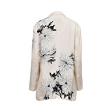 Back view of the Momoni cream blazer, displaying the continuation of the artistic black-and-white floral sketch pattern across the shoulders and lower hem with a center vent.