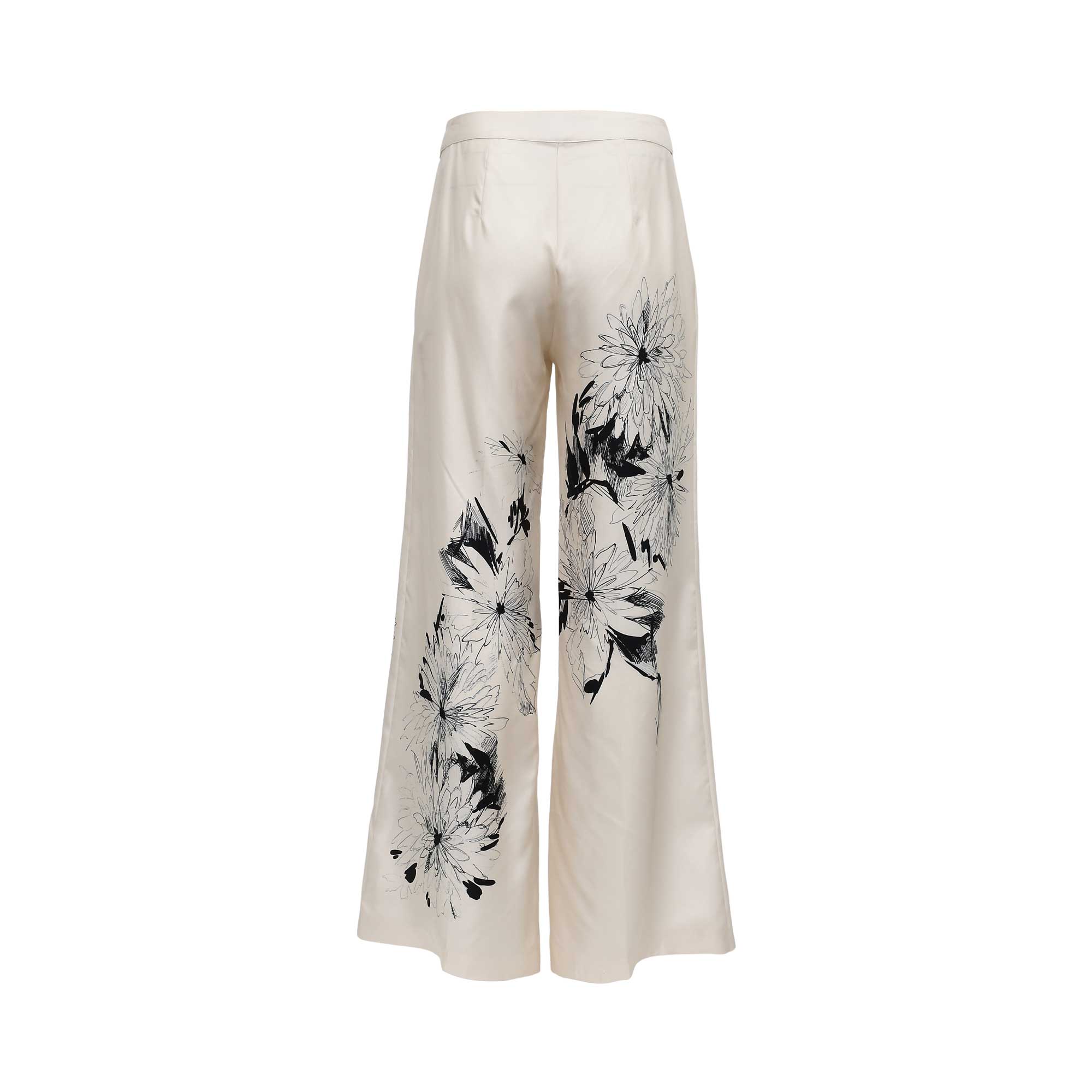 Back view of Momoni cream wide-leg trousers showing the continuation of the artistic black-and-white floral sketch print and tailored rear dart detailing.