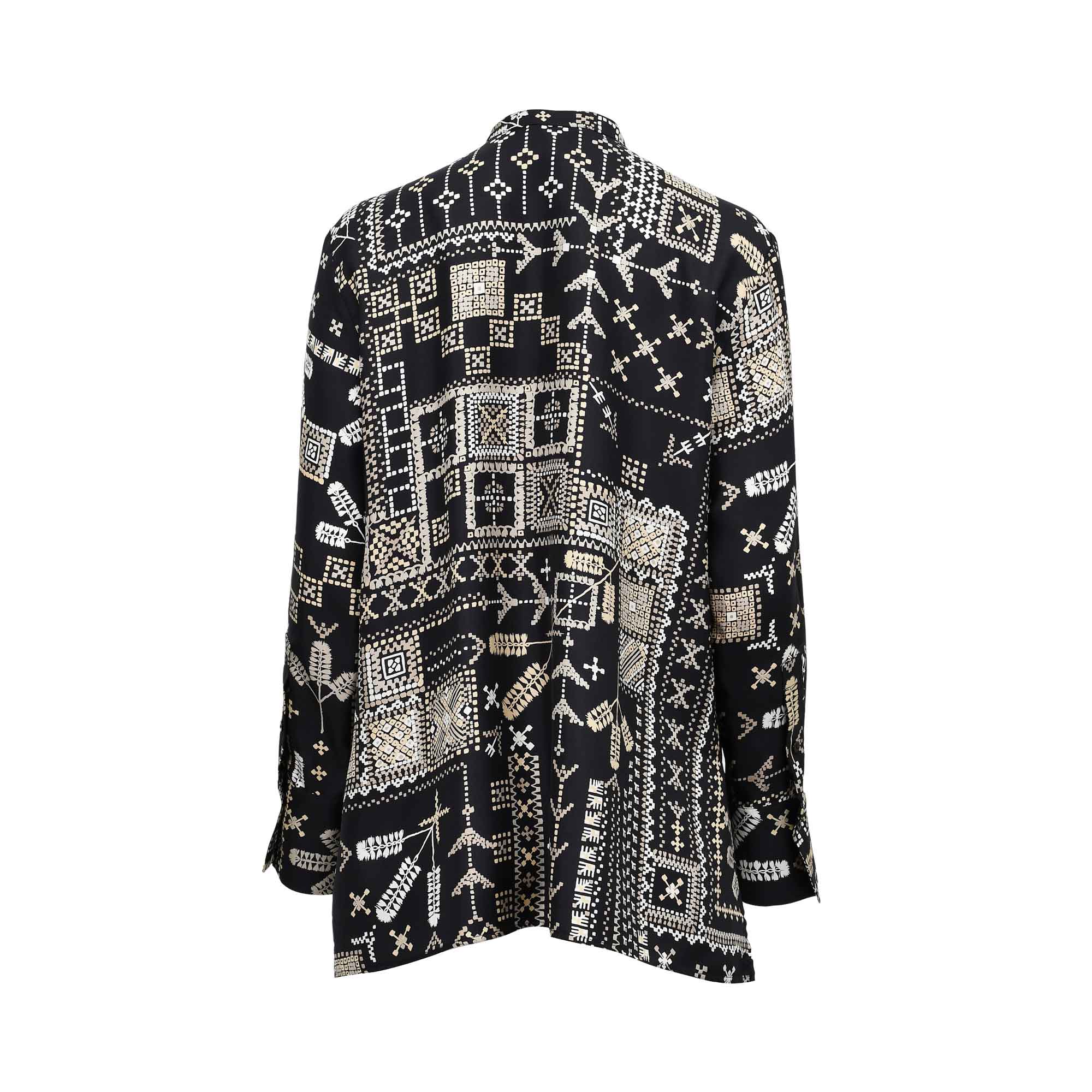 Back view of the MOMONI printed shirt showing the intricate all-over ivory pattern on a black background and the relaxed, fluid drape of the fabric.