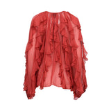 Rear view of the Momonì red sheer blouse showing the continuation of vertical ruffles and the lightweight, flowing drape of the chiffon fabric.