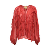 Front view of a Momonì red sheer silk-chiffon blouse featuring vertical cascading ruffles, a V-neckline, and long voluminous sleeves on a white background.