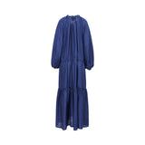 Back view of the Momoni rust blue maxi dress highlighting the fluid silk fabric and the gathered detail at the high neckline and waist.