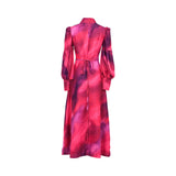 Rear view of the MOONMAINS magenta gown showing the high collar, cinched tie-back waist, and the continuous abstract pattern.