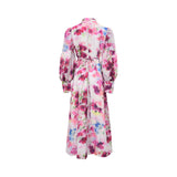 Rear view of the MOONMAINS floral gown showing the tie-waist detail, high collar, and the continuation of the painterly floral pattern.