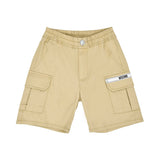 Close-up of the beige cargo shorts featuring a silver button, side pockets, and a branded Moschino logo strip.