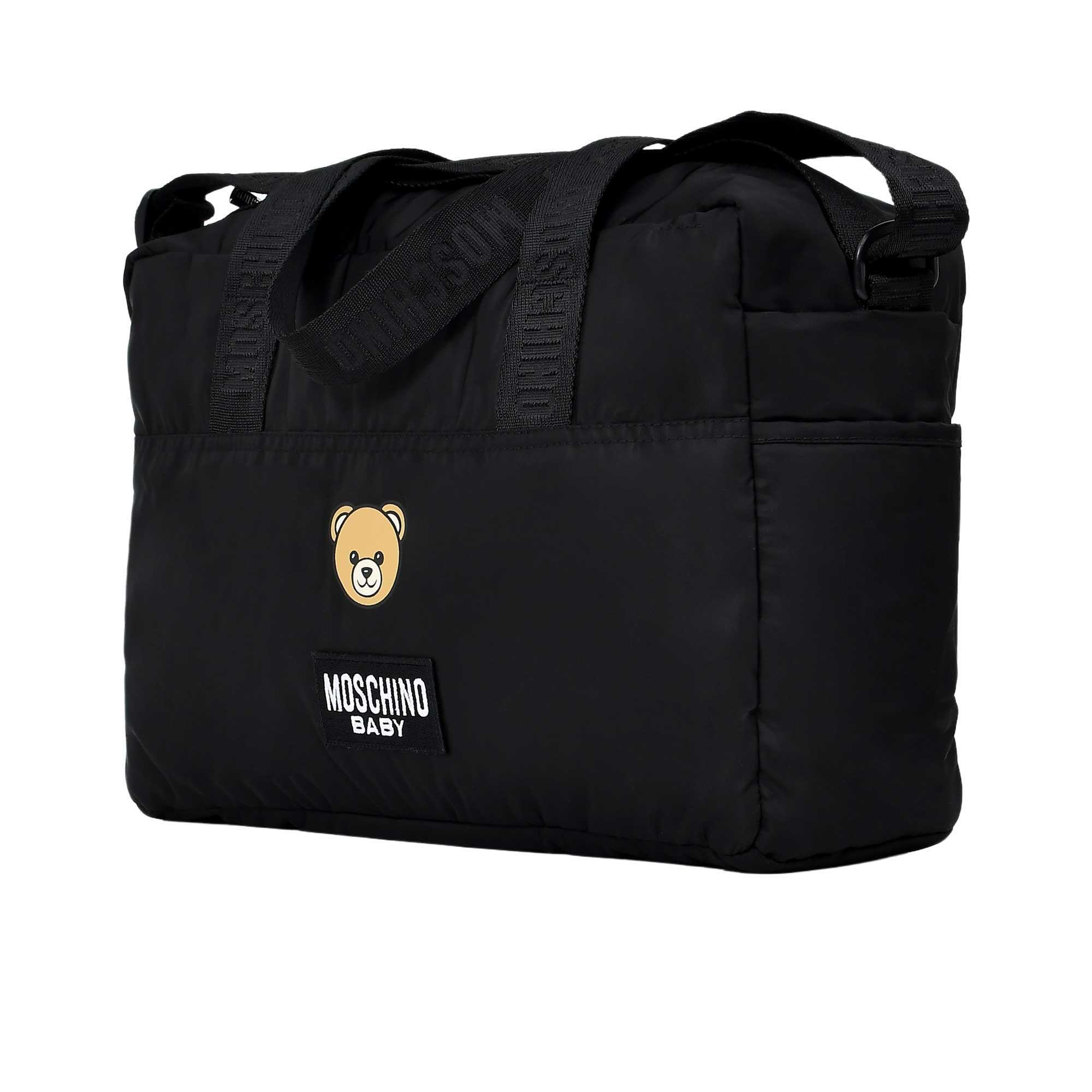 Black baby bag with Moschino Baby logo and bear emblem on a white background.