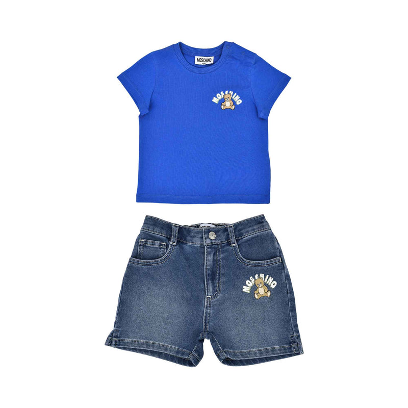 A two-piece Moschino Baby set featuring a royal blue T-shirt with a Teddy Bear logo and matching mid-wash blue denim shorts.