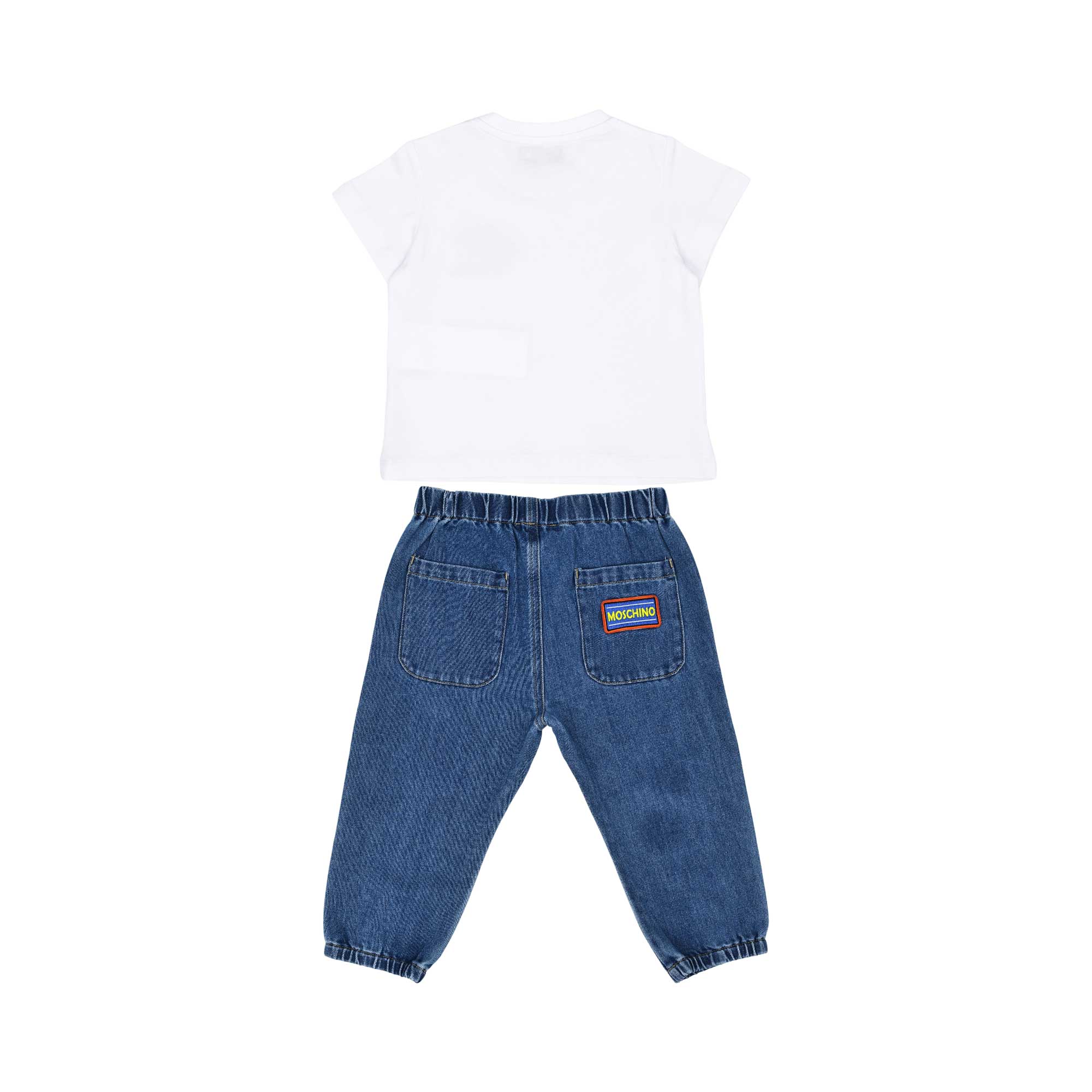 Rear view of the Moschino baby set showing the plain white T-shirt and denim pants with back pockets and a logo patch.