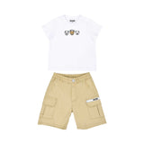 A baby's designer outfit set including a white T-shirt with three teddy bear faces and beige cargo-style shorts.
