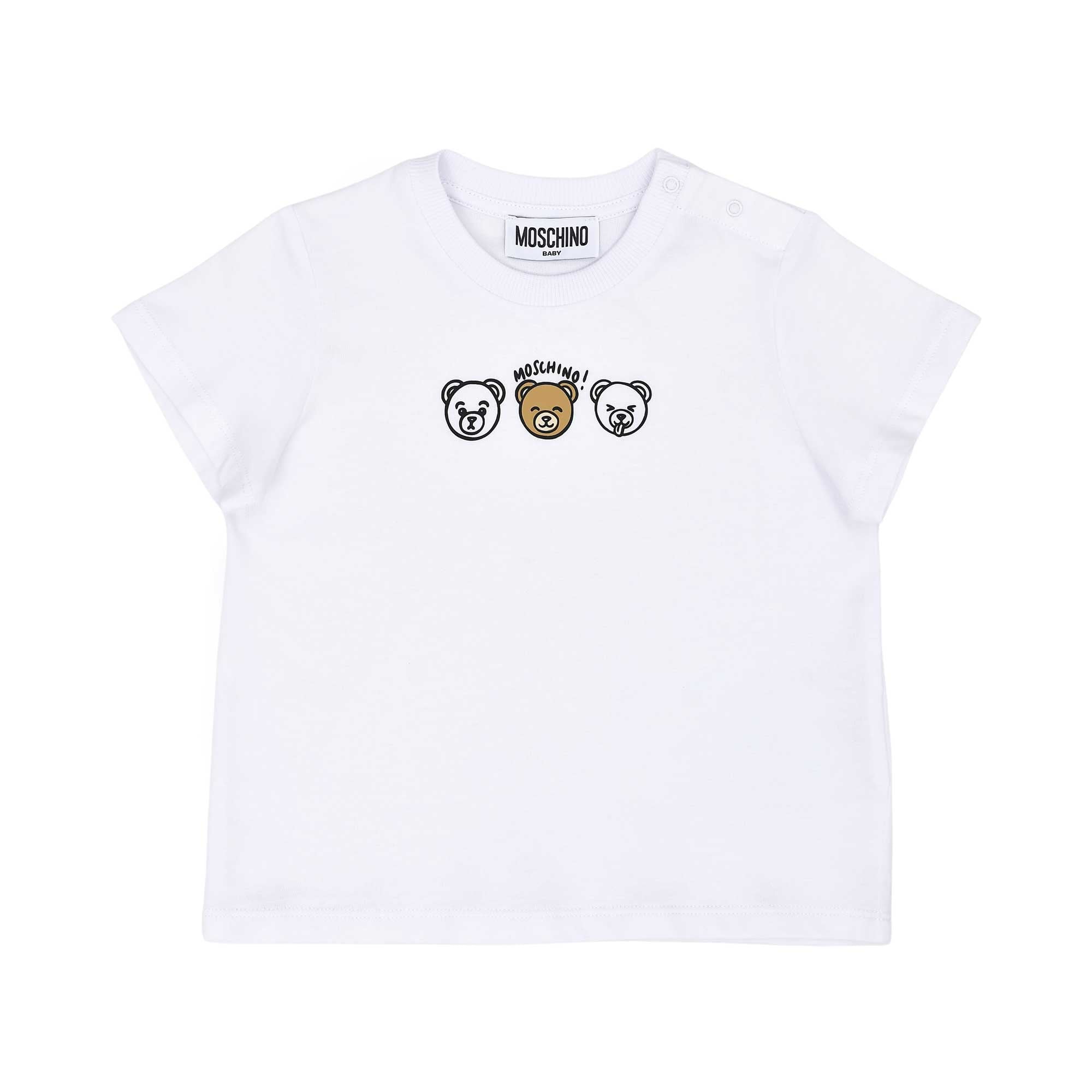 Detailed view of the white cotton baby T-shirt highlighting the three teddy bear graphics and shoulder snap buttons.