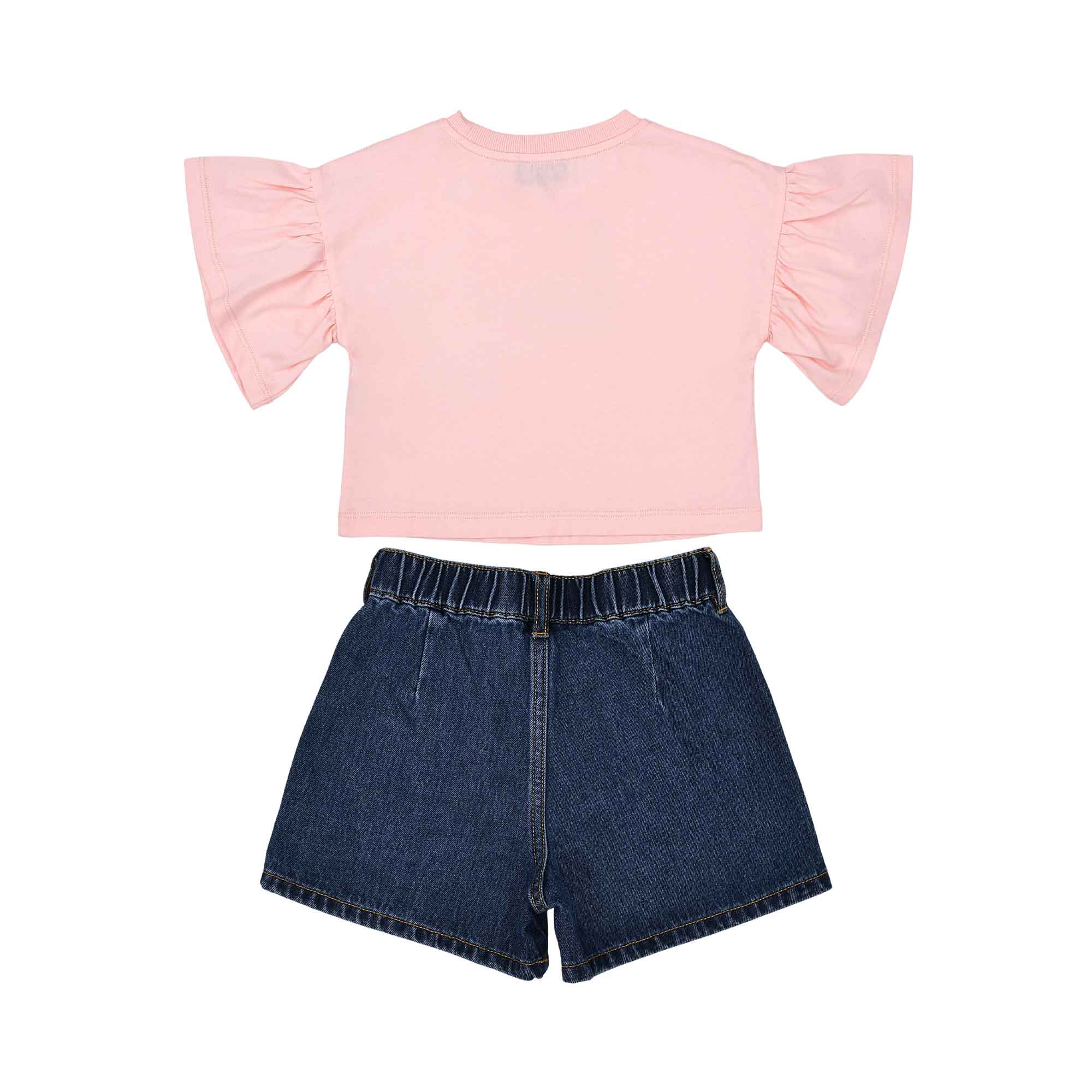 Rear view showing the plain pink back of the T-shirt and the gathered elastic waistband of the denim shorts.