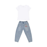 Rear view of the Moschino Kid set showing the plain white T-shirt and denim jeans with a cherry graphic on the back pocket.