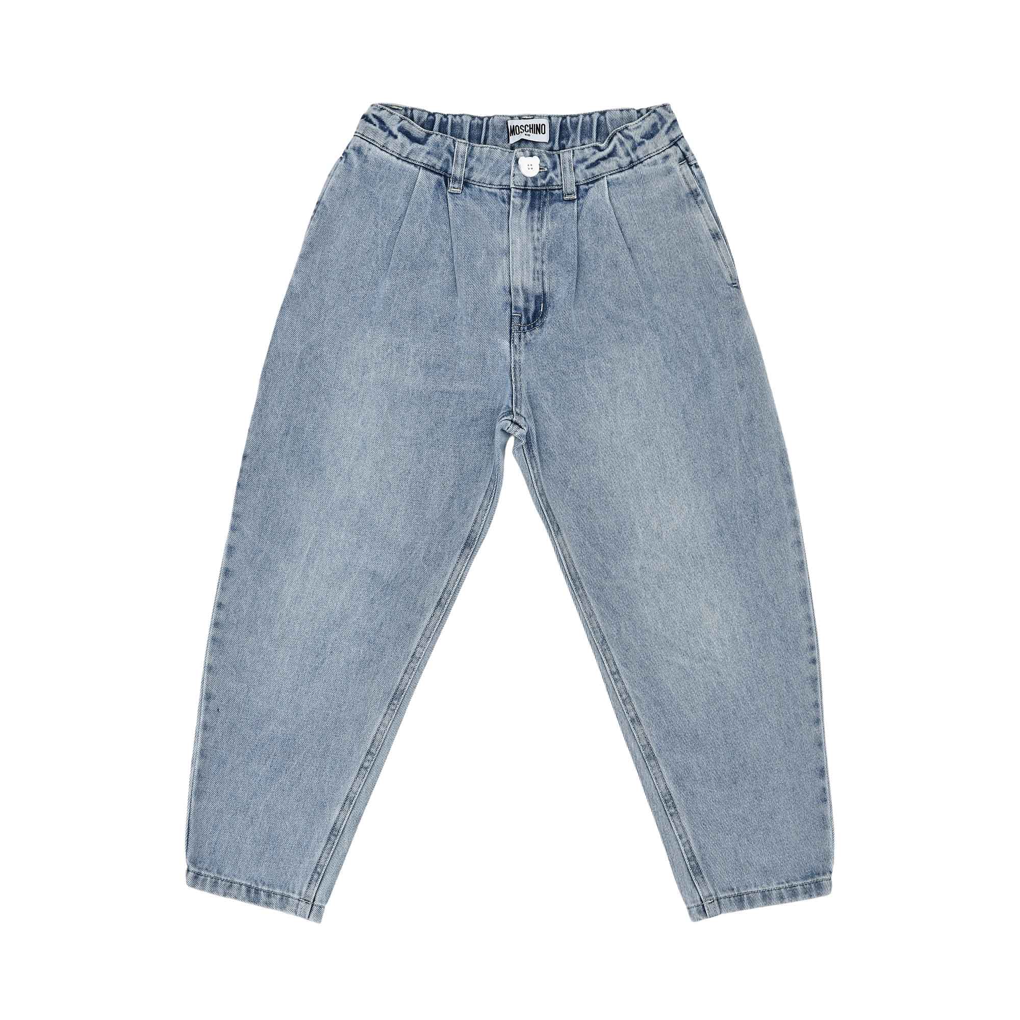 Close-up of the front of the light-wash denim jeans showing the elasticated waist, pleats, and white button.