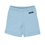 ront view of the sky blue Moschino Baby shorts featuring an elasticated ribbed waistband and a black printed logo on the left hip.
