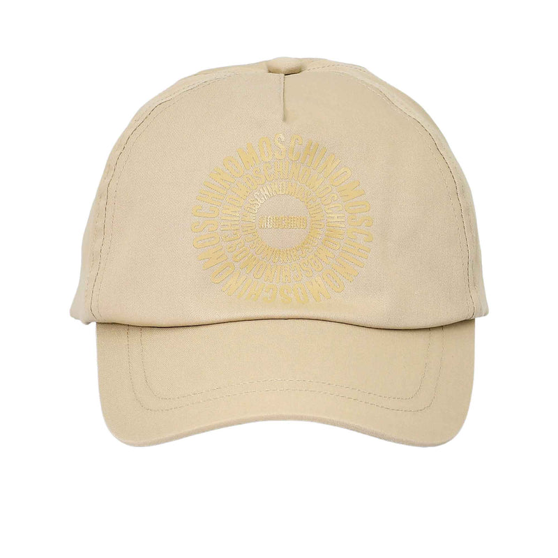 Frontal view of a beige Moschino Kids baseball cap showcasing a tonal, circular repeat logo printed on the center crown.