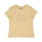 Front view of a sand-colored Moschino Kids t-shirt featuring a subtle, tonal circular logo design printed in the center of the chest.