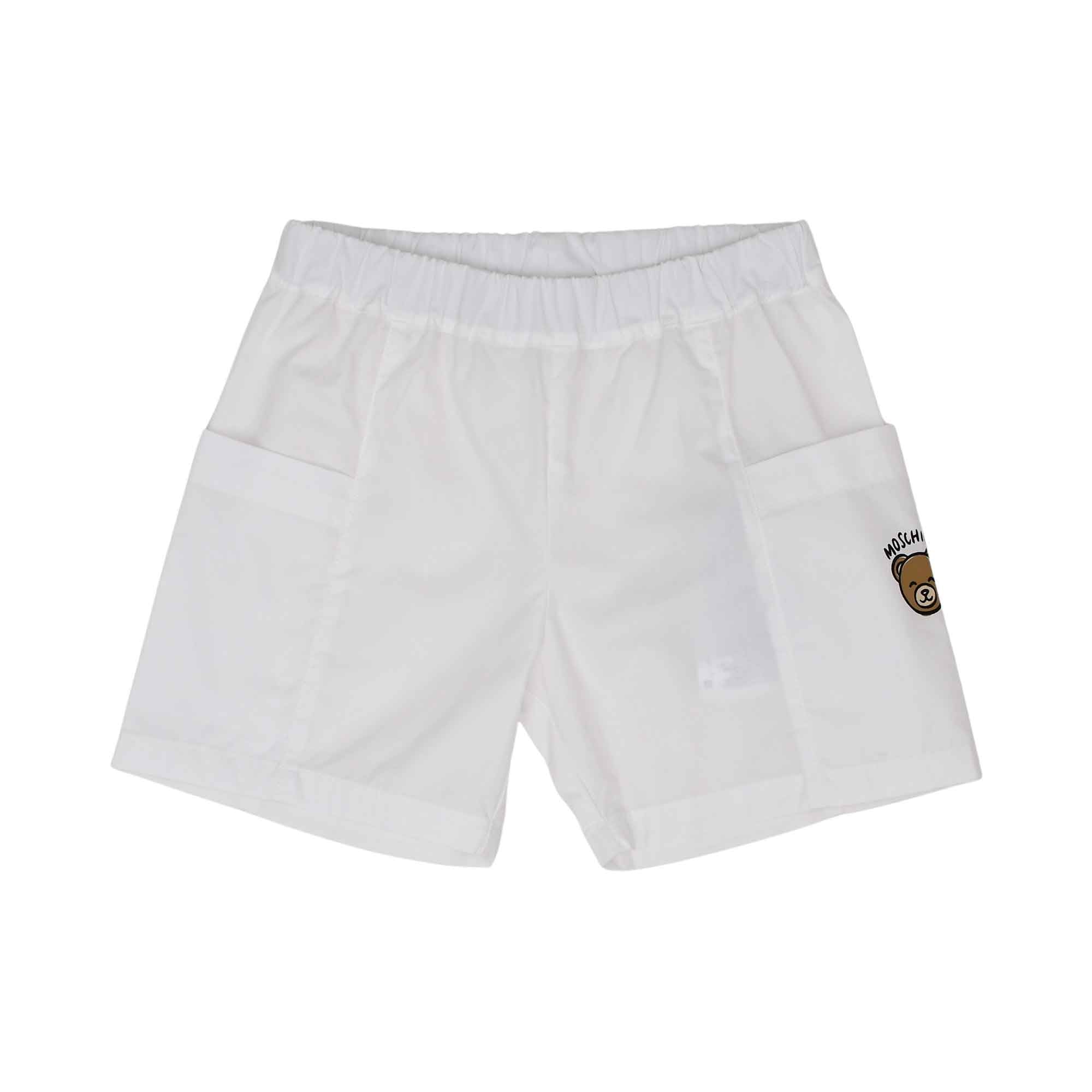 Front view of the white shorts featuring an elasticated waist and a small Teddy Bear logo on the side cargo pocket.