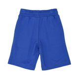 Back view of the royal blue cotton shorts showing the elasticated waistband and textured fabric.