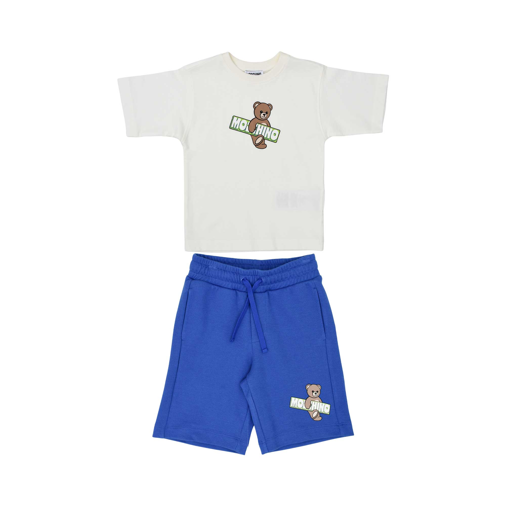 Front view of a Moschino Kids set featuring a white T-shirt and blue shorts with Teddy Bear surfboard graphics.