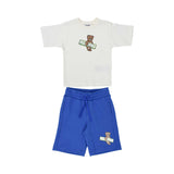 Front view of a Moschino Kids set featuring a white T-shirt and blue shorts with Teddy Bear surfboard graphics.