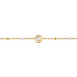 Detailed close-up shot of the Celeste bracelet charm, highlighting the precise clear crystal pavé halo and the central gold 1881 monogram.