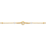 Detailed close-up studio shot of the Celeste bracelet charm, showcasing the clear crystal pavé halo framing the gold 1881 monogram.