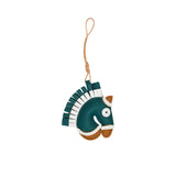 A handcrafted leather bag charm by MUNI shaped like a horse's head. The charm features a brown leather face, a layered fringe mane in alternating tan and ochre, and a cream-colored leather loop for attachment against a white background.