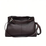 Back view of a brown MUNI leather shoulder bag showing the flat panel structure and strap attachments at BLUE SALON.