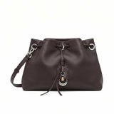 Front view of a brown MUNI leather drawstring shoulder bag with silver hardware from BLUE SALON.