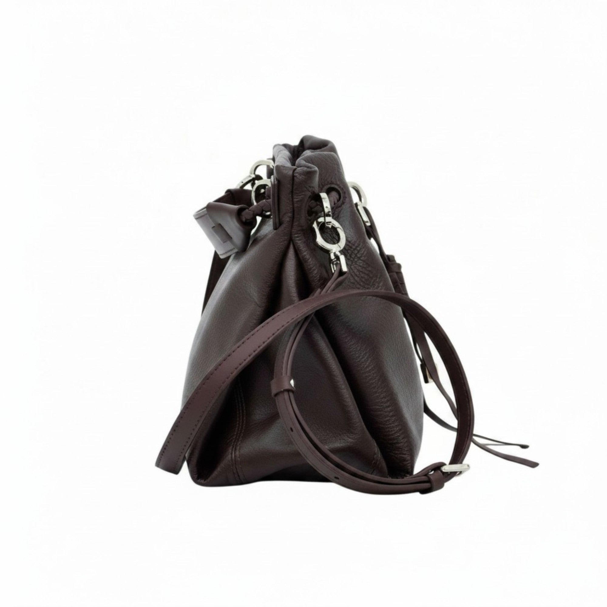 Direct side profile view of a brown leather MUNI bucket-style shoulder bag with visible stitching from BLUE SALON.