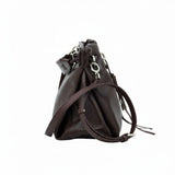 Direct side profile view of a brown leather MUNI bucket-style shoulder bag with visible stitching from BLUE SALON.
