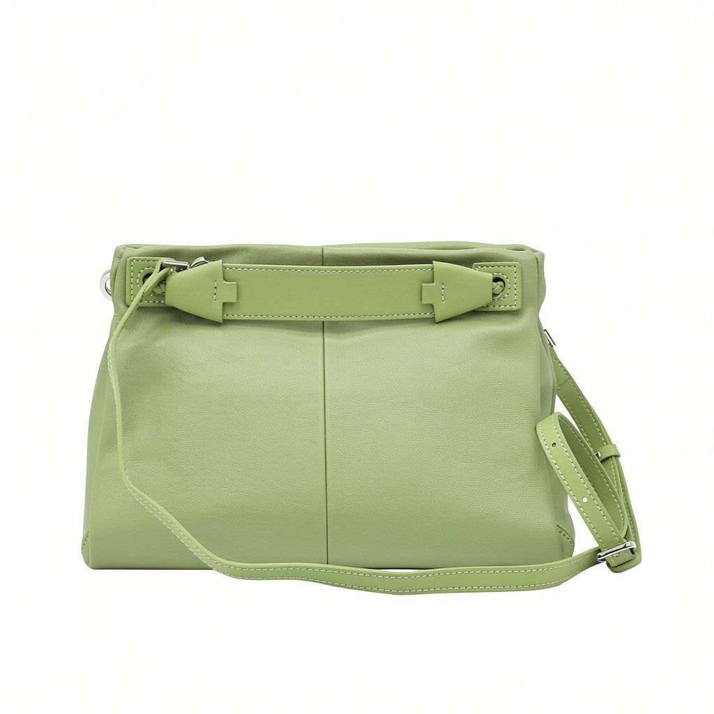 Back view of a light green MUNI leather shoulder bag showing the flat panel structure and strap attachments at BLUE SALON.