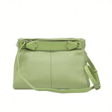 Back view of a light green MUNI leather shoulder bag showing the flat panel structure and strap attachments at BLUE SALON.
