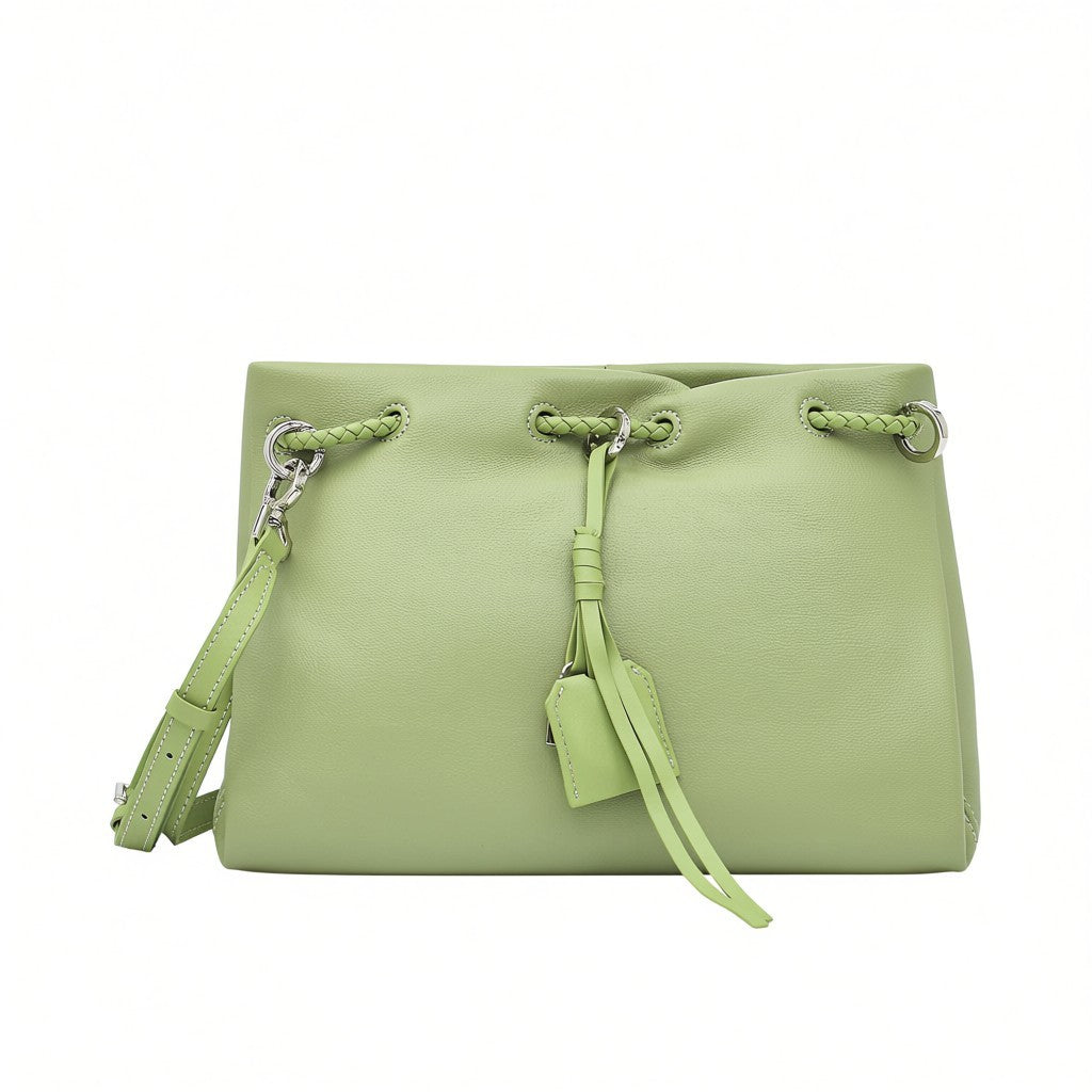 Front view of a pastel green MUNI leather drawstring shoulder bag with silver hardware from BLUE SALON.