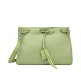 Front view of a pastel green MUNI leather drawstring shoulder bag with silver hardware from BLUE SALON.