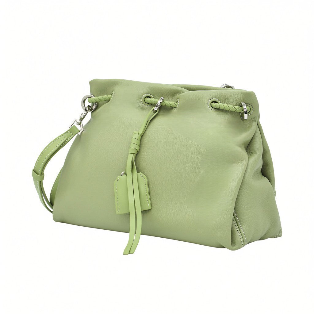Front-angled perspective of a light green leather MUNI shoulder bag showing its slouchy silhouette, exclusively at BLUE SALON.