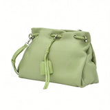 Front-angled perspective of a light green leather MUNI shoulder bag showing its slouchy silhouette, exclusively at BLUE SALON.