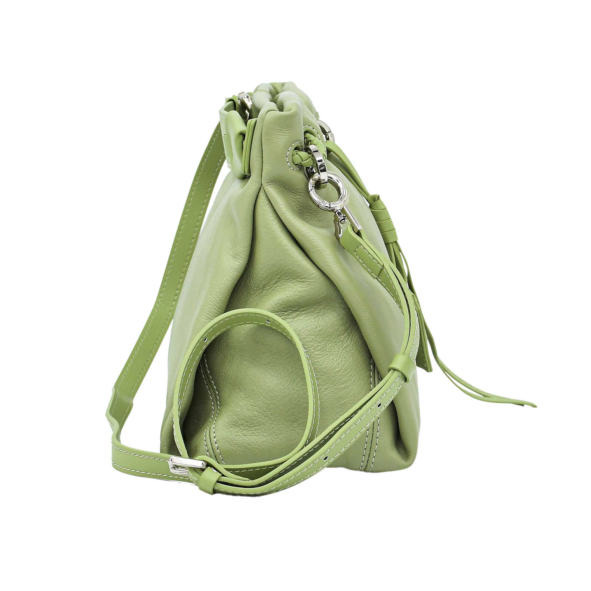 Side-angled view of a mint green leather MUNI shoulder bag with tassel details, showcased by BLUE SALON.