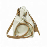 Direct side profile view of a light green leather MUNI bucket-style shoulder bag with visible stitching from BLUE SALON.