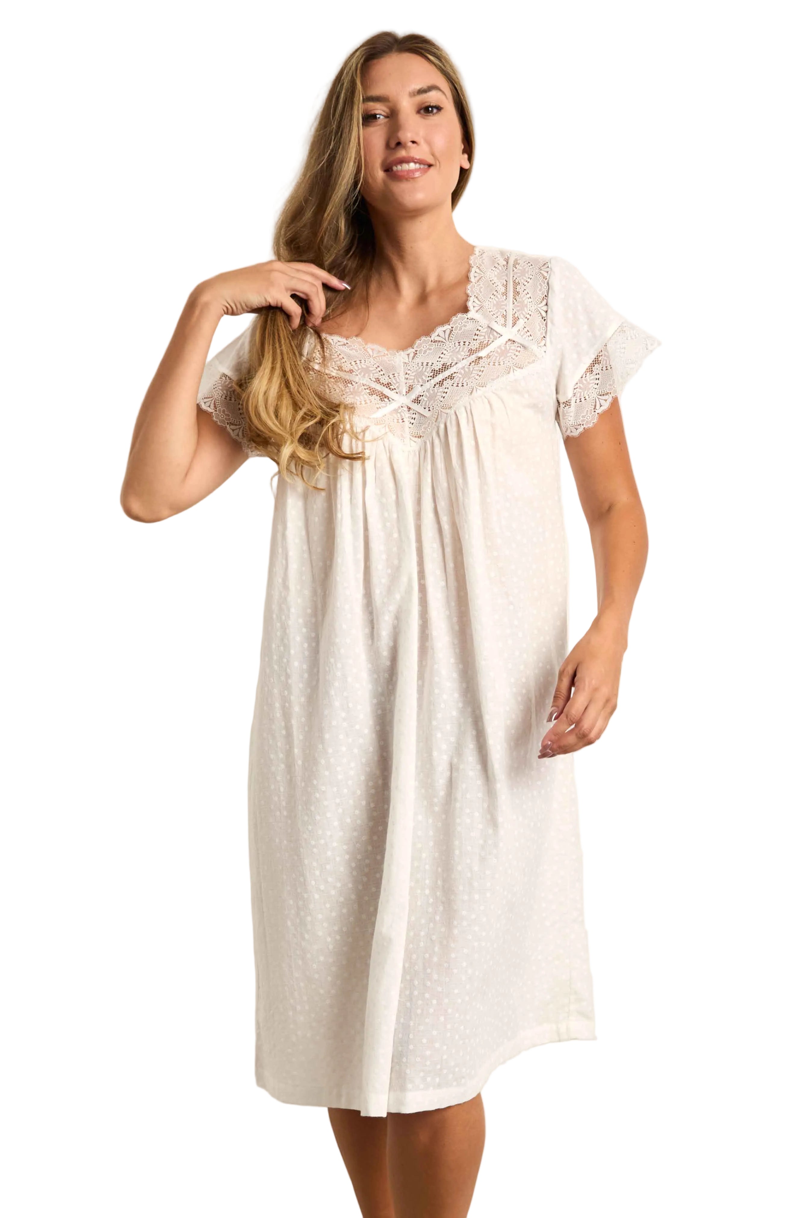 Cream short-sleeve nightdress with honeycomb jacquard and embossed daisy pattern, featuring lace-trimmed V-neck and yoke.