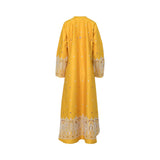 The rear view of a yellow NERO maxi dress showing scattered white embroidered details and a wide, intricate arch-patterned border at the hemline.