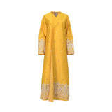 A full-length saffron yellow kaftan by NERO featuring a crossover V-neck, long sleeves, and a white architectural embroidered border along the bottom hem and cuffs.