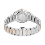 Back of a silver-toned watch with a rose gold-toned bezel. The two-tone metal link bracelet has silver-toned outer links and