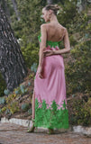 Pink satin maxi slip dress with green lace trim at the bust and a wide green lace panel at the hem with a high side slit.