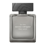 A front-facing view of the Narciso Rodriguez "For Him Musc Santal" fragrance bottle, featuring a minimalist frosted grey glass design with a rectangular silhouette and a dark, wood-textured block cap.