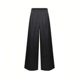 Rear view of Nenette black wide-leg high-waisted trousers showcasing smooth fabric draping and minimalist tailoring detail against a clean white background.