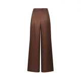 Back view of Nenette wide-leg satin trousers in chocolate brown, highlighting the smooth high-rise waistband, structured rear darts, and fluid, flowing fit.